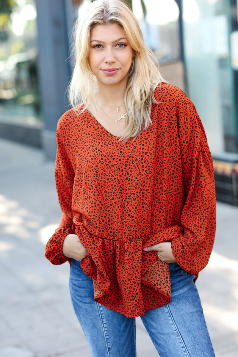 Feeling Bold Rust Leopard Print V Neck Peplum Top