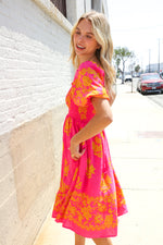 Beautiful You Coral Floral & Border Print Smocked Dress