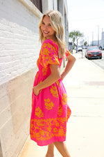 Beautiful You Coral Floral & Border Print Smocked Dress